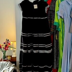 Long black, cap sleeve smock dress with white ribbon details